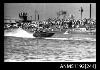 Black and white negative number 16 depicting power boat at speed  starboard side view at Stuart Doyle Gold Cup in New South Wales