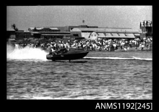 Black and white negative number 17 depicting Maxina , 760N Power boat at speed