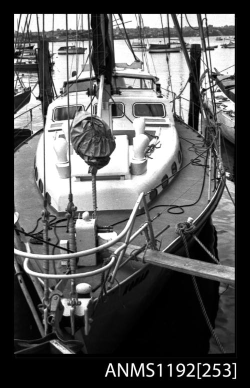 Black and white negative number 12 depicting view of bow of Nomad Yawl rigged motor yacht