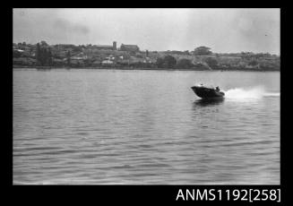 Black and white negative number 17 depicting view of MELODEE III AA4N open power boat at speed