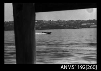 Black and white negative number 19 depicting view of MELODEE III , AA4N open power boat under way