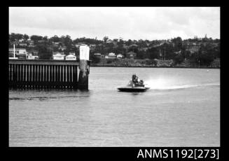 Black and white negative number 1A depicting power boat under way