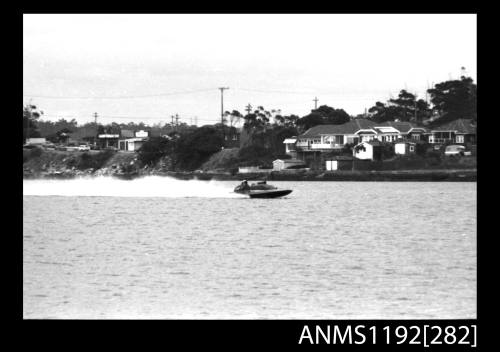 Power boat at speed at time trials at St George Motor Boat Club, Georges River, Sydney