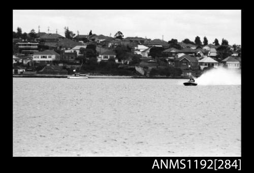 Power boat at speed at time trials at St George Motor Boat Club, Georges River, Sydney