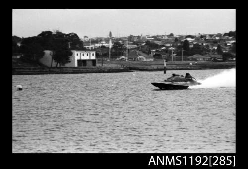 Black and white negative number 13A depicting WASP , 478N Power boat at speed