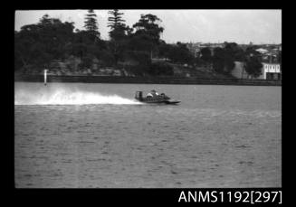 Black and white negative number 25A depicting power boat at speed  Stern/ starboard side viewat time trials at St George Motor Boat Club, Georges River, Sans Souci, Sydney, New South Wales