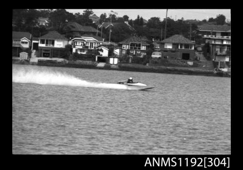 Power boat at speed at time trials at St George Motor Boat Club, Georges River, Sydney