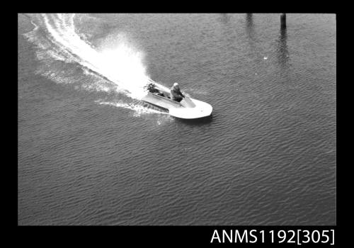 Power boat at speed at St George Motor Boat Club, Georges River, Sydney