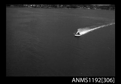 Power boat at speed at St George Motor Boat Club, Georges River, Sydney