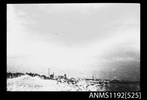 Black and white negative number 6A depicting view of two power boats at speed, almost hidden by spray