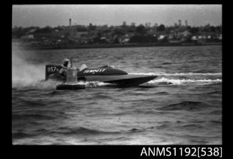 Black and white negative number 10 depicting view of TEMPEST 957N hydroplane passing a marker buoy