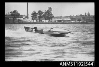 Black and white negative number 16 depicting view of KK9N hydroplane at speed