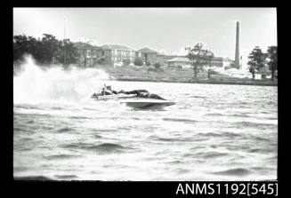 Black and white negative number 17 depicting view of oc8n hydroplane at speed