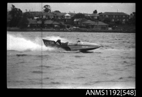 Black and white negative number 20 depicting view of KK9N hydroplane at speed