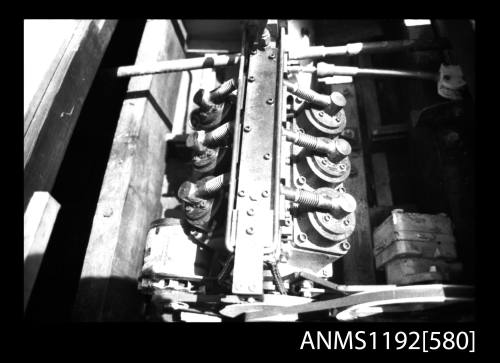 Black and white negative number 3 depicting view of v-6 cylinder steam engine, overhead view