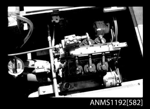 Black and white negative number 5 depicting view of v-6 cylinder steam engine, starboard side view