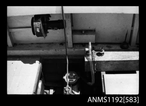 Black and white negative number 6 depicting view of controls and regulator of a v-6 cylinder steam engine