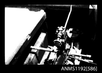 Black and white negative number 9 depicting view of controls and piping mounted on top of steam engine