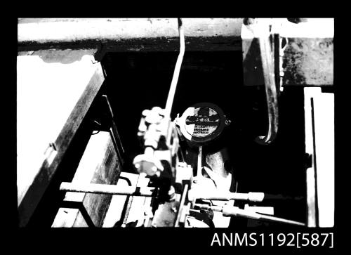 Black and white negative number 10 depicting view of controls and piping mounted on top of steam engine