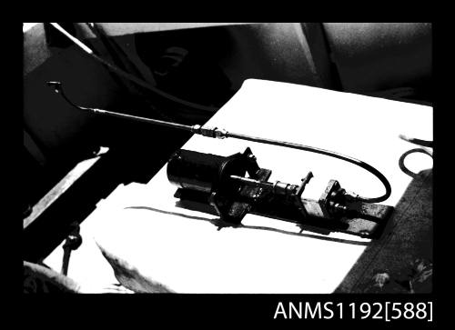 Black and white negative number 11 depicting view of fuel controller for boiler