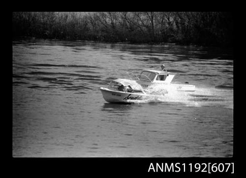 Black and white negative number 8A depicting view Scudding Chi2n power boat overtaking jw20n power boat, elevated port side view