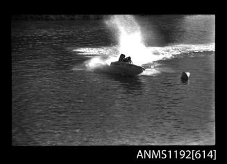 Black and white negative number 15A depicting view of GOLDILOCKS Gl74n power boat at speed