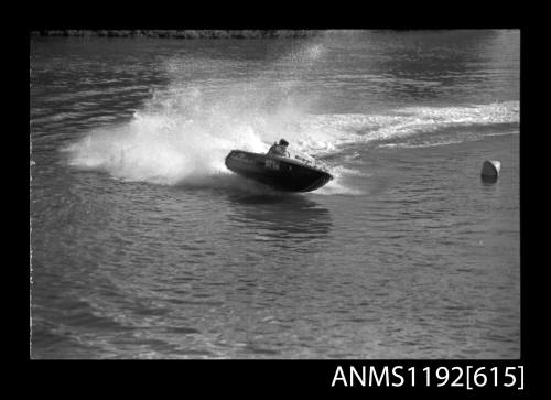 Black and white negative number 16A depicting view of Tahitian Bt1n power boat at speed