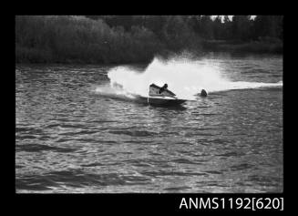 Black and white negative number 2A depicting view of hydroplane at speed, turning at marker buoy