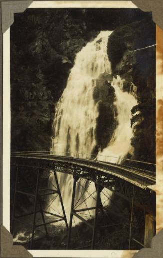 A train track crossing a waterfall