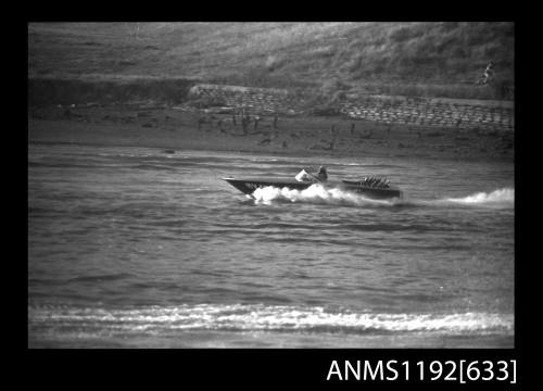 Black and white negative number 15A depicting view of HY18N HORNET (Inboard engine), at speed, port side view