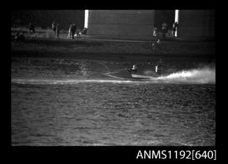 Black and white negative number 22A depicting view of hydroplane SR16N at speed, starboard side view