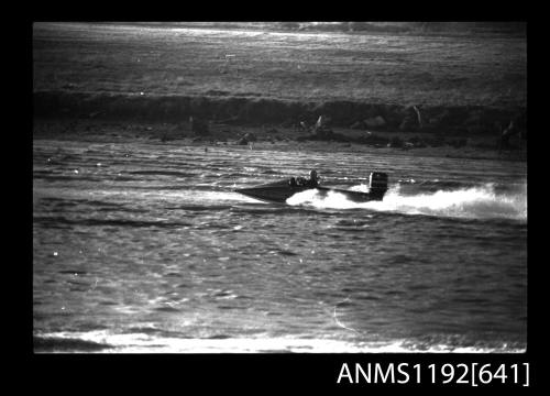 Black and white negative number 23A depicting view of hydroplane SR16N at speed, starboard side view