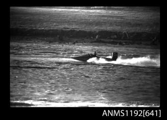 Black and white negative number 23A depicting view of hydroplane SR16N at speed, starboard side view