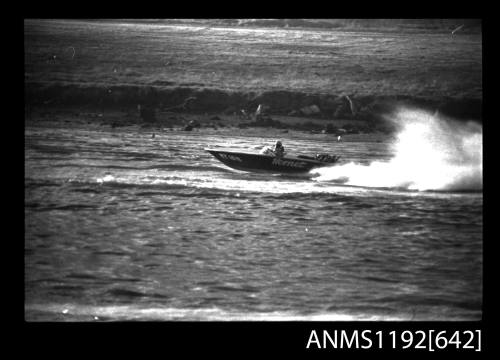 Black and white negative number 24A depicting view of HORNET HY18N power boat at speed, port side view