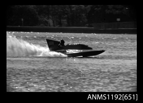 Black and white negative number 6A depicting view of Norman 160N hydroplane at speed, starboard side view