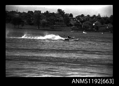 Black and white negative number 18A depicting view of ALDOR KO1N hyroplane at speed, starboard side view