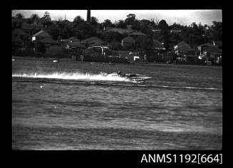 Black and white negative number 19A depicting view of CLOVER Hydroplane at speed, starboard side view