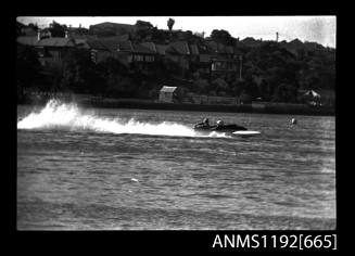 Black and white negative number 20A depicting view of TM55N Hydroplane at speed, starboard side view