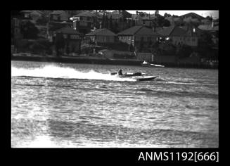 Black and white negative number 21A depicting view of Dr62n Hydroplane at speed, starboard side view