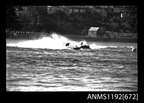 Black and white negative number 27A depicting view of ALDOR KO1N And a second hydroplane turning together at marker buoy, bow/ starboard side view