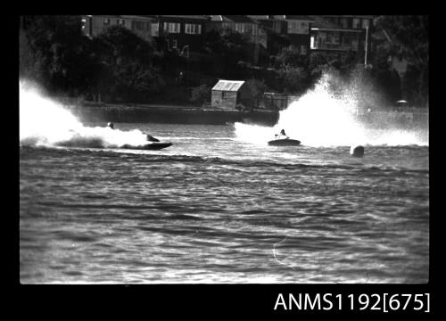 Black and white negative number 30A depicting view of two hydroplanes approaching marker buoy, centre left starboard side view, and centre right Bow - on view