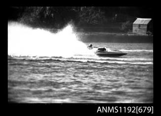 Black and white negative number 34A depicting view of hydroplane at speed, starboard side view
