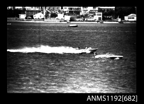 Black and white negative number 11 depicting view of KING-O-KATS And AMBITION II open power boats, outboard engines