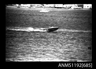 Black and white negative number 14 depicting view of KATCH-MEE , open power boat, outboard engine