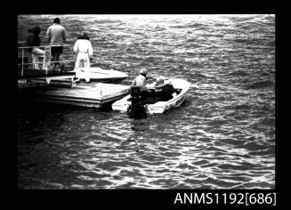 Black and white negative number 15 depicting view of HUNTER open power boat with outboard engine, and another unidentified open power boat