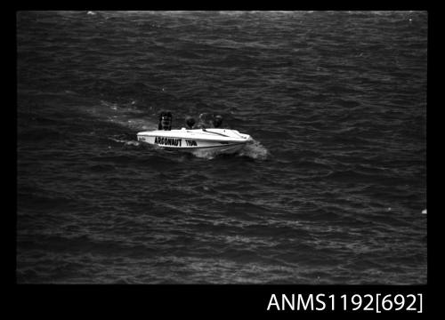 Black and white negative number 21 depicting view of ARGONAUT TY64N open power boat with outboard engine