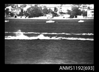 Black and white negative number 22 depicting view of HUNTER Td30n open power boat with outboard engine