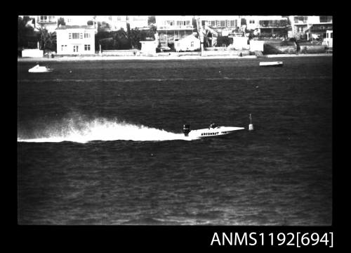 Black and white negative number 23 depicting view of ARGONAUT ty64 open power boat with outboard engine