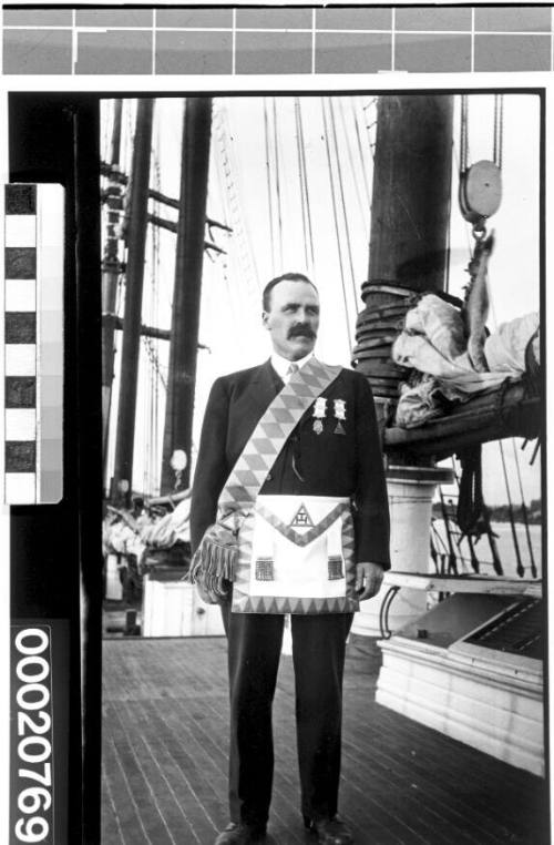 Unidentified American merchant marine officer wearing a free mason apron