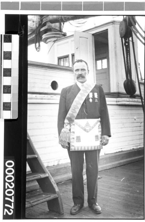 Unidentified American merchant marine officer wearing a free mason apron